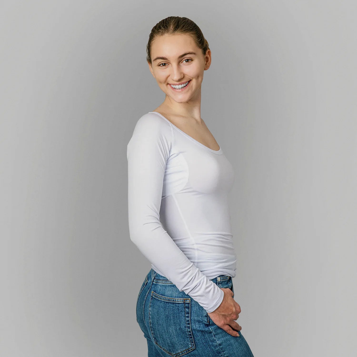 Studio photo of female model wearing ANTI-SWEAT SHIRT WOMEN undershirts from ConfidenceForAll