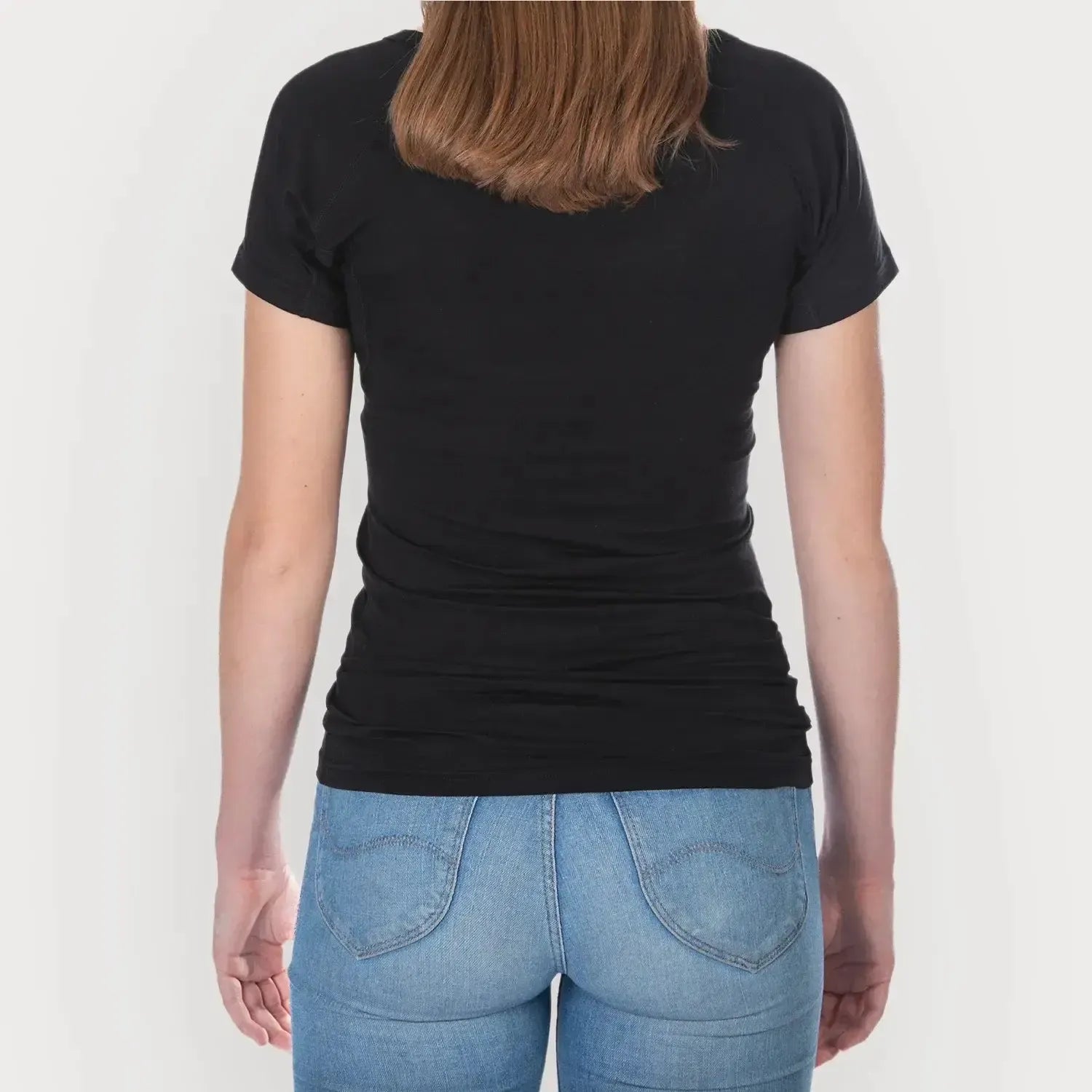 Studio photo of female model wearing ANTI-SWEAT SHIRT WOMEN undershirts from ConfidenceForAll