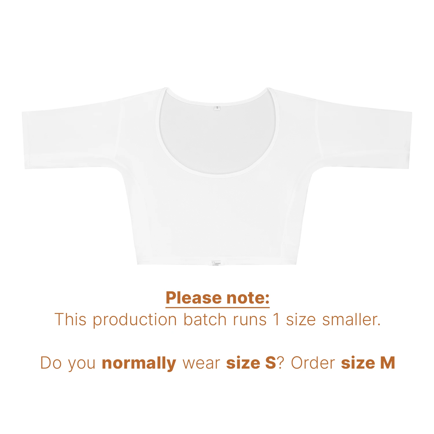 Flatlay studiophotography of ConfidenceForAll White half-sleeve crop top with text stating this batch runs one size smaller; size S wearers should size up to M.