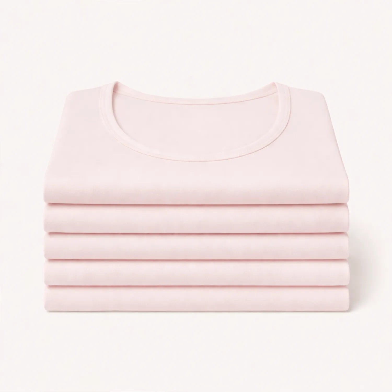 5-pack lichtroze Confidence For All dames anti-zweet T-shirts netjes opgestapeld, basic shirts met ronde hals.